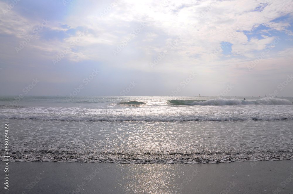 Obraz premium The beach against sunset sky.