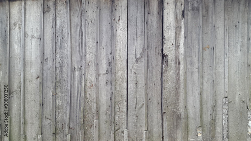 Old gray boards. A panel made of old weathered sedges. Wooden vintage background