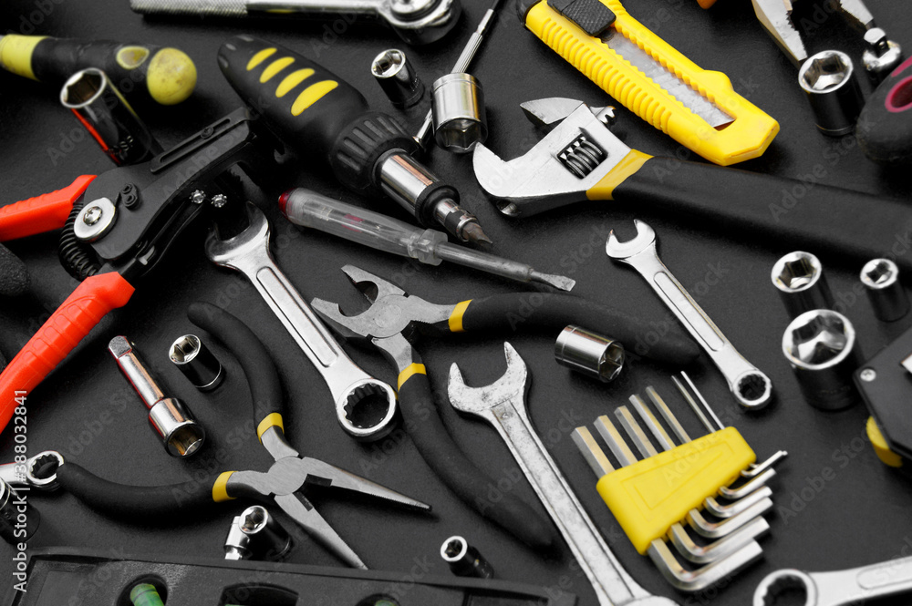 Many different tools for repair work on a black background. Many different tools for repair work on a black background.
