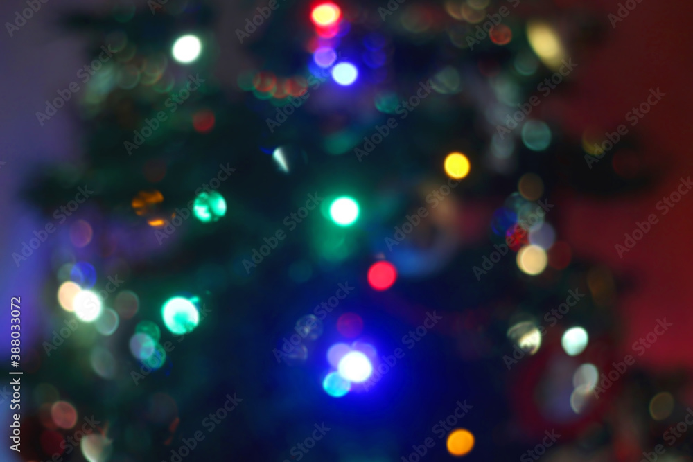 Colorful Christmas bokeh lights. Defocused Christmas background.