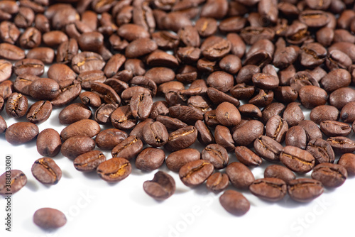 Coffee beans on white background.Fragrant fried coffee beans.