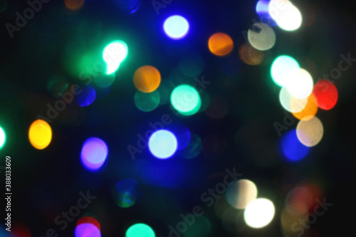 Colorful Christmas bokeh lights. Defocused Christmas background.