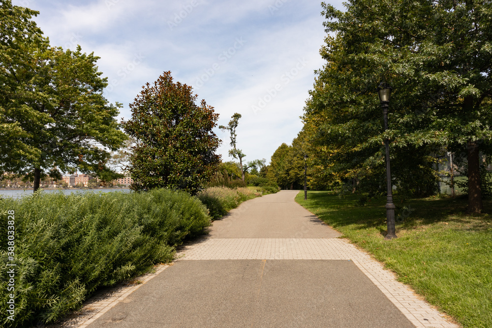 Empty Trail along the Riverfront of Randalls and Wards Islands in New York City during Summer Empty Trail along the Riverfront of Randalls and Wards Islands in New York City during Summer