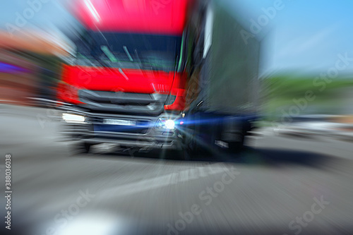 Truck with red cab on the road in motion. Accident rate. View from the cab of the car
