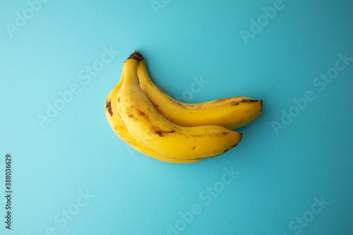 yellow banana on light blue background