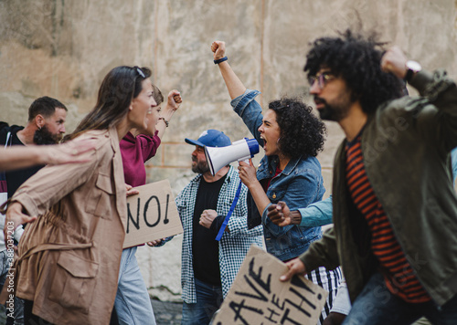 Group of people activists protesting on streets, strike, demonstration and fight concept. photo