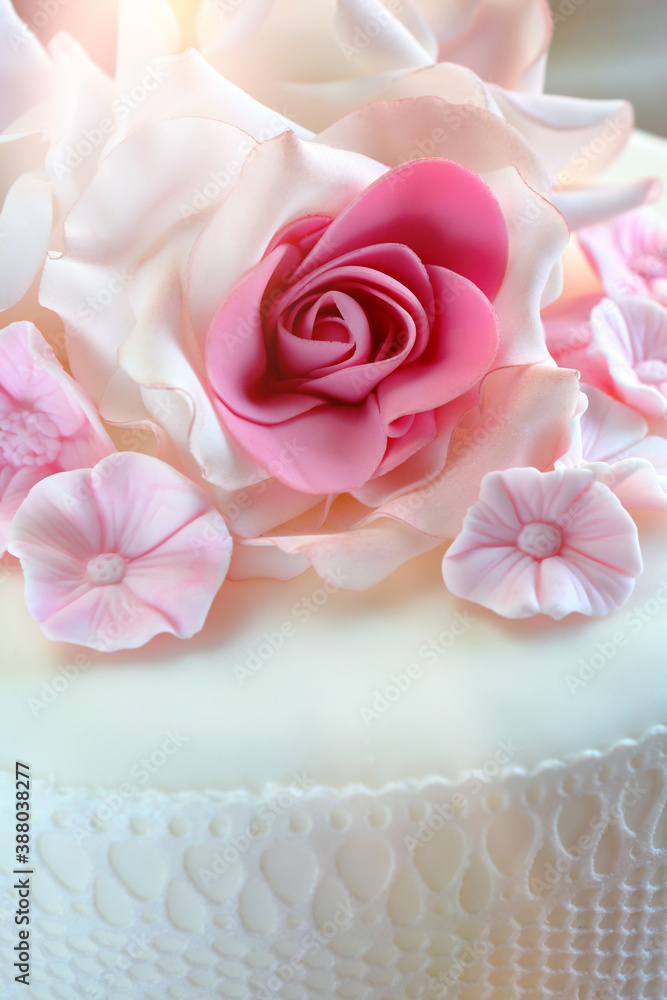 Sugar rose decoration for a wedding cake and empty space for text Sugar rose decoration for a wedding cake and empty space for text