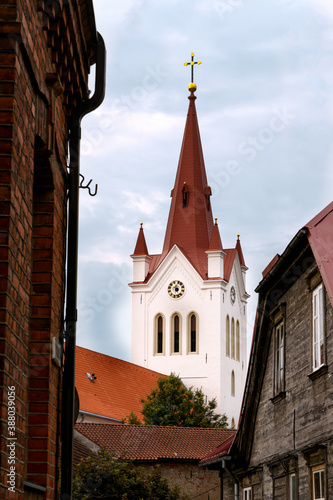 Church tower with a cross on the street of the small town of Cesis in Latvia. photo