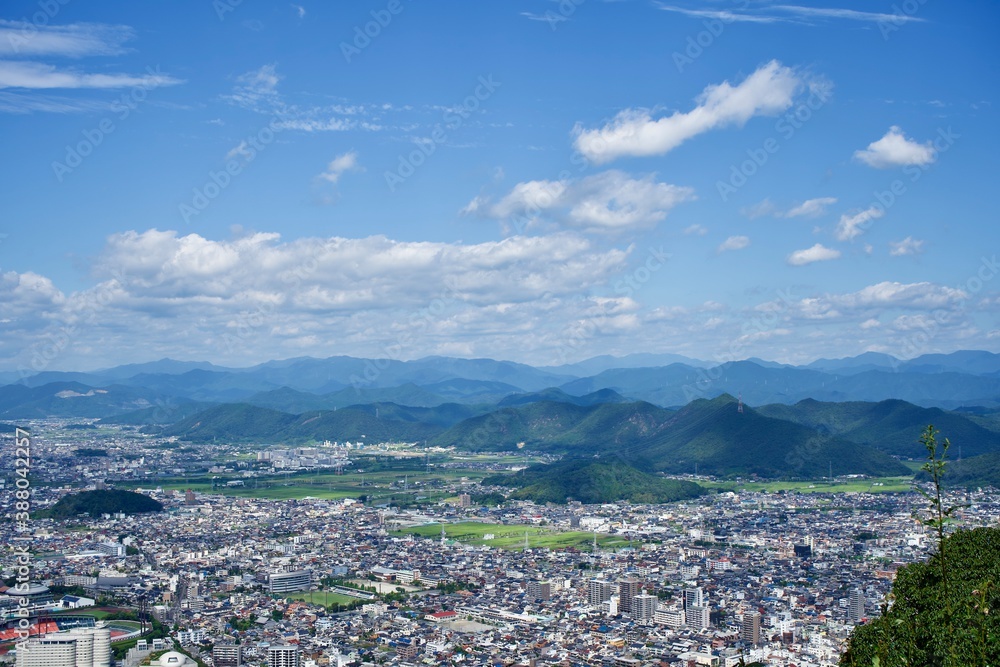 The view of the city and mountains in Japan.