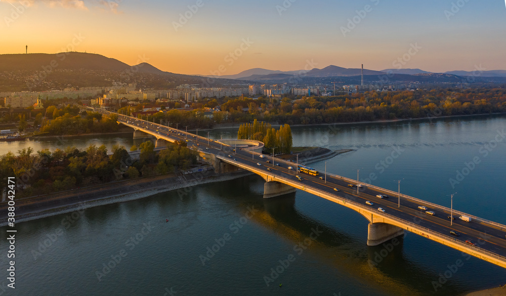 Budapest, Hungary - aerial view of Arpad Bridge at autumn sunset with buda hills at the background