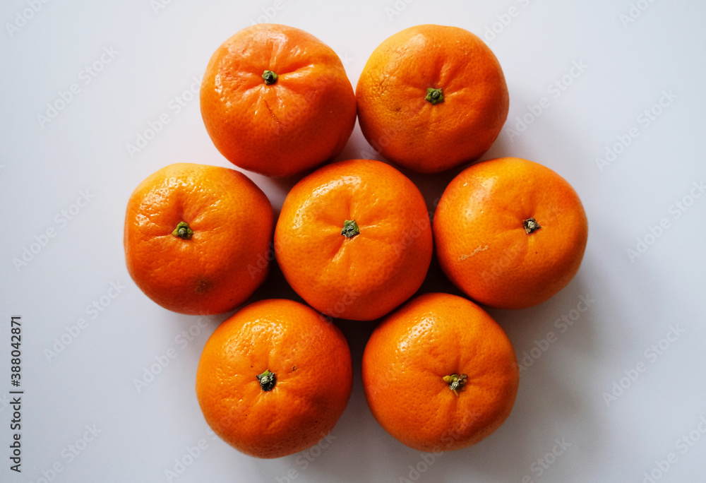 Seven tangerines on white background top view Seven tangerines on white background top view
