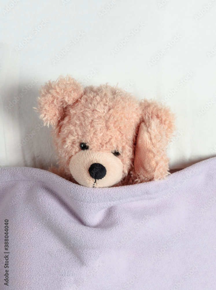 Headache, insomnia. Cute teddy ill laying in bed