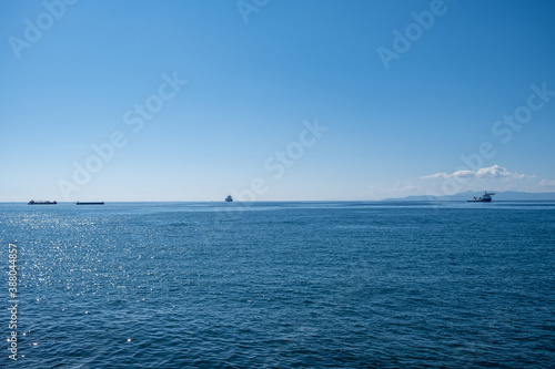 Drapetsona shipyard, Piraeus, Greece. Moored containers cargo ships loaded background.