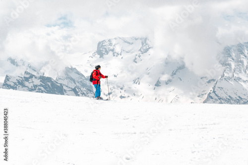 North Caucasus, skier in the mountains against the snow in winter,