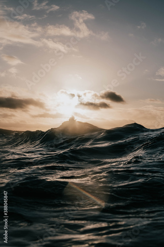 waves crashing with sunrise 