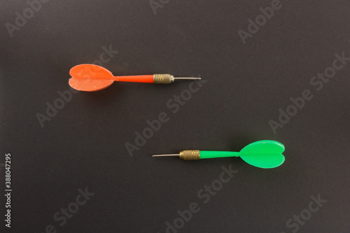 Darts needles on a black background