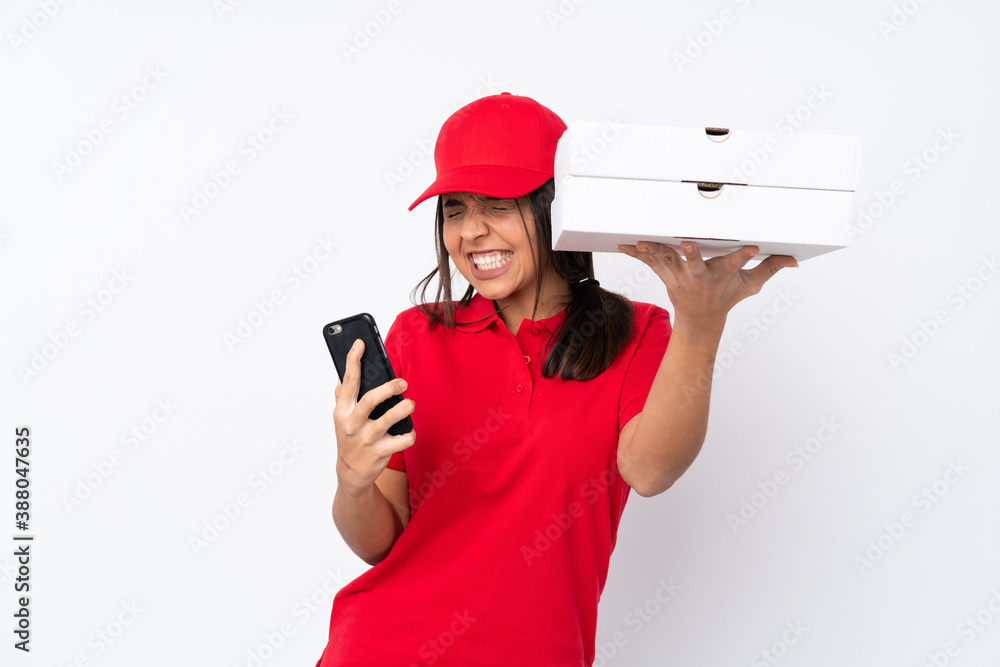 Young Pizza delivery girl over isolated white background with phone in victory position Young Pizza delivery girl over isolated white background with phone in victory position