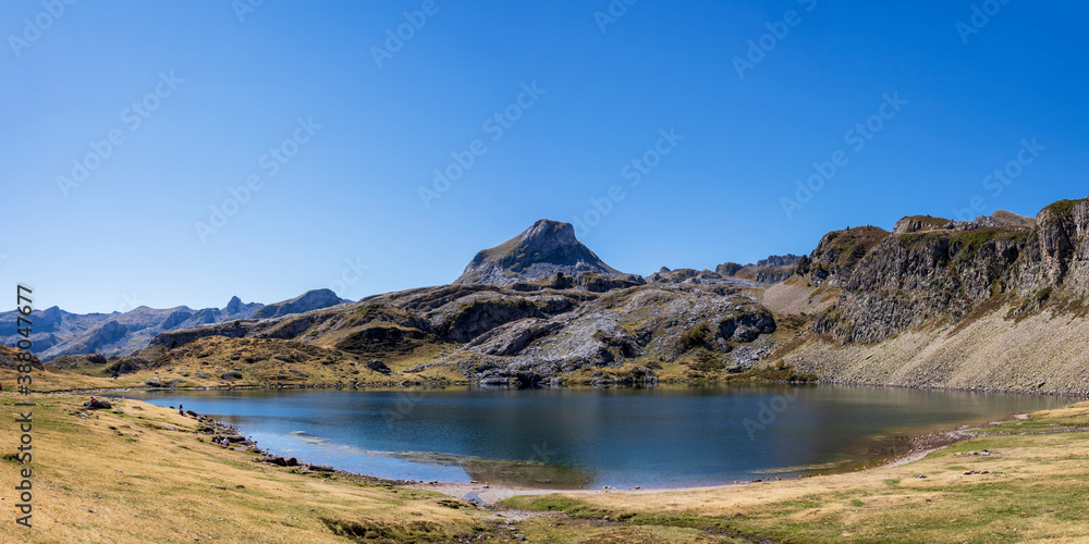 Pic du Midi Ossau mountain and Lac Gentau lake in the french Pyrenees mountains, Pyrenees National Park, France