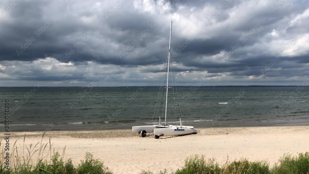 catamaran boat resting on the beach catamaran boat resting on the beach
