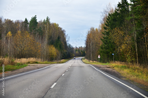 Road in autumn landscape. Tver region, Russia