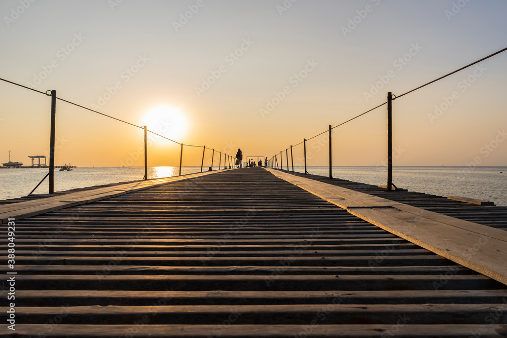 Fototapeta premium Long pier for ships at sea at sunset.Magnificent sunset landscape with a view of the Black sea.