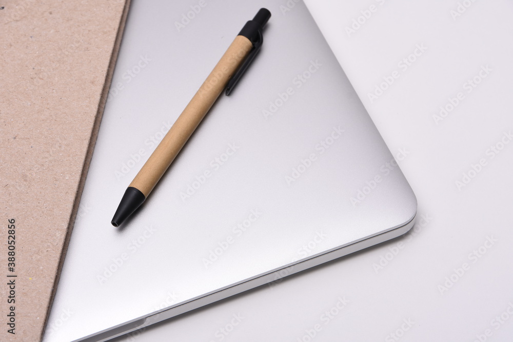 Desk with laptop, books and business pen Desk with laptop, books and business pen