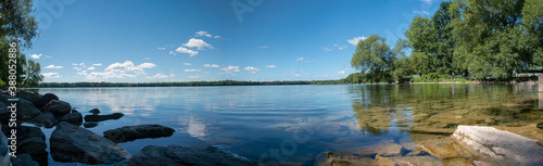 A panoramic view of the crystal clear waters of Lake on a Mountain near Picton in Prince Edward County, Ontario as they glisten in the morning sun on a beautiful late summer day.