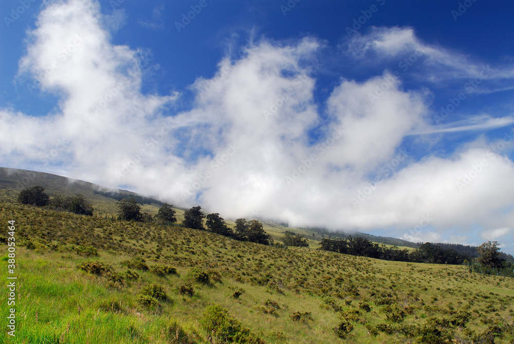 Clouds rolling down the side of Haleakala volcano in Maui