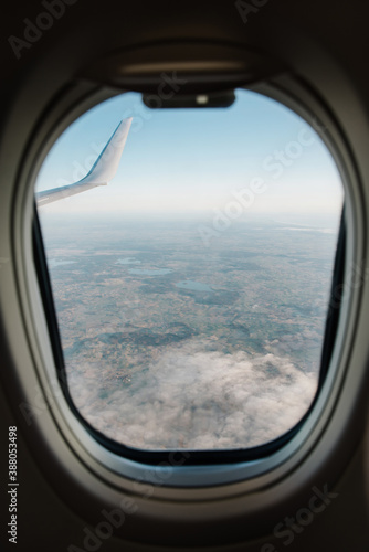 Airplane interior with window view over clouds. Concept of travelling.
