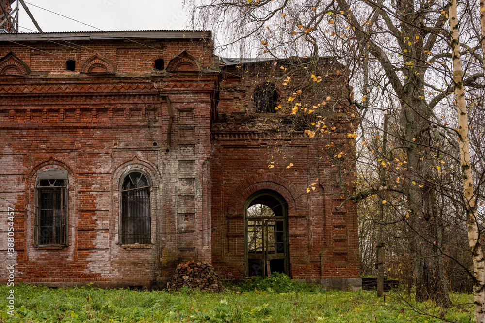 old abandoned red brick building on autumn sad day