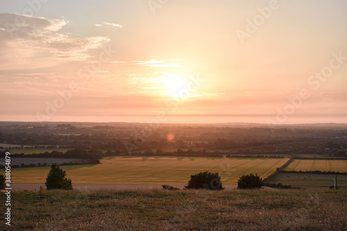 Vibrant Sunset Across Irish Meadow Landscape