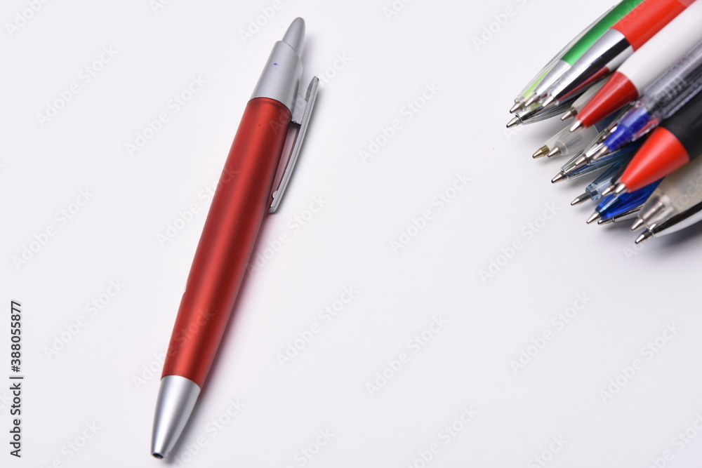 Many multicolored pens on a white background Many multicolored pens on a white background