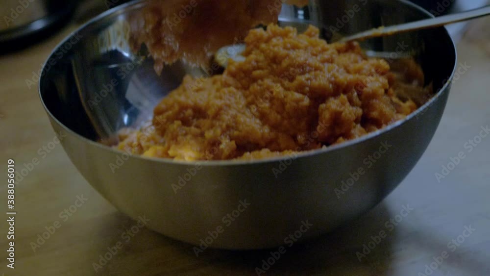 Slomo camera zoom out into a pumpkin cake batter into a bowl, Slomo camera zoom out into a pumpkin cake batter into a bowl,
