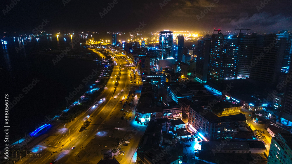 Road, lights and sea at night.
Luanda city captured from the top
