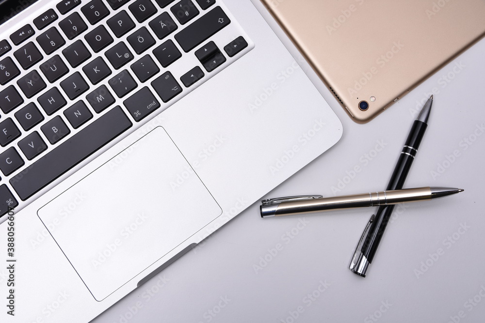 Business place with laptop, pad and pen Business place with laptop, pad and pen