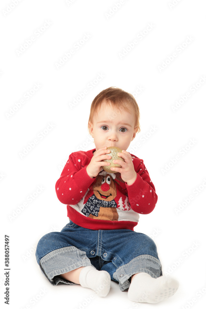 Baby playing with Christmas balls, isolated on white Baby playing with Christmas balls, isolated on white