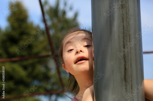 Little girl having fun on the playgound photo