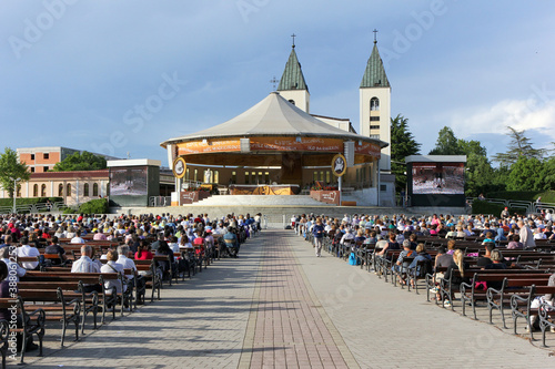 Medjugorje, BiH. 2016/6/5. People praying before a holy mass in the exterior prayer area at the St James church in Medjugorje.