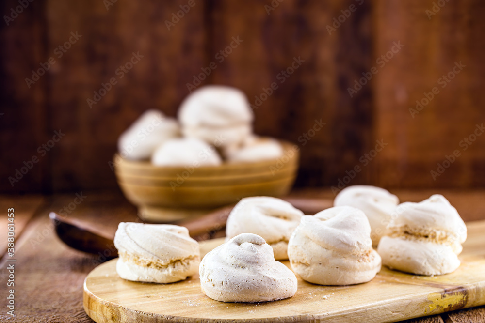 portion of homemade cookies, called meringue or sighs, typical egg yolk cake with sugar