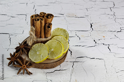 lime cinnamon and star anise on cracked table