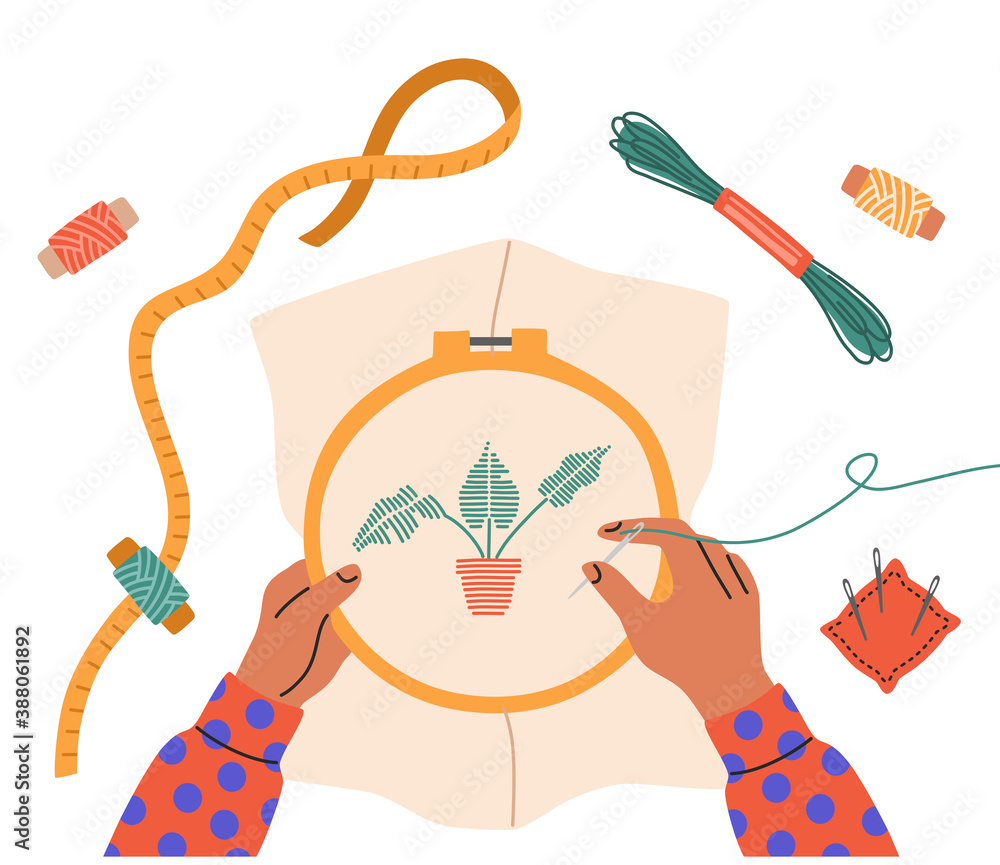 Top view of a child's hands embroider a flower, sewing needles ...