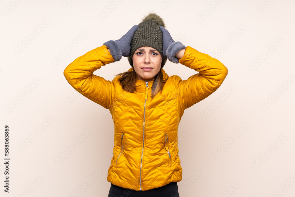 Woman with winter hat over isolated background with surprise facial expression Woman with winter hat over isolated background with surprise facial expression