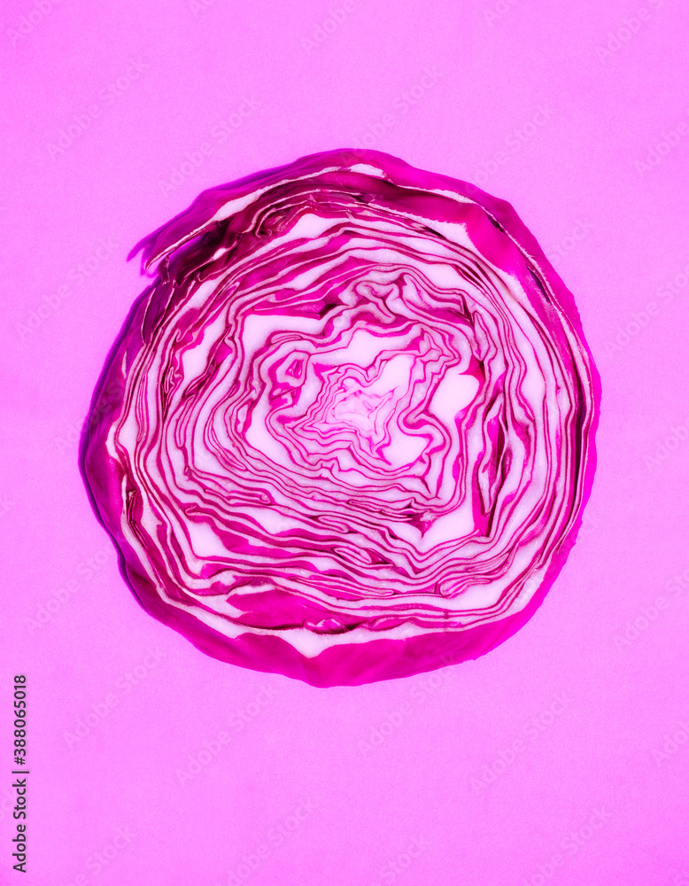 Fototapeta premium red cabbage in a cut on a pink background