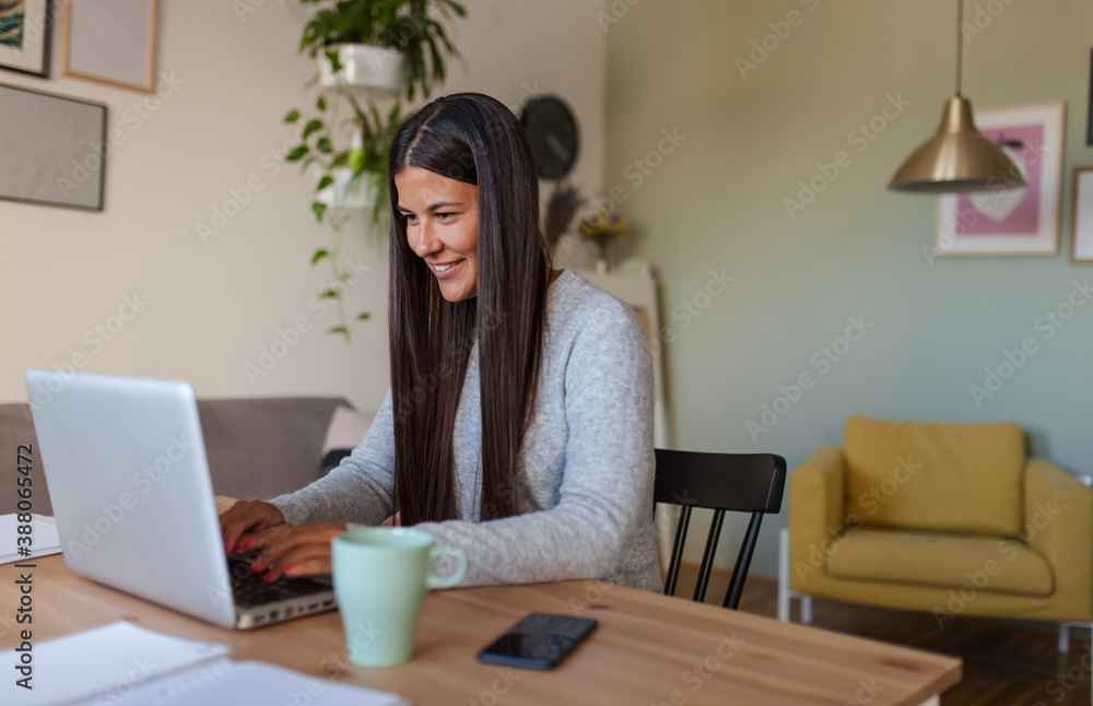 Portrait of young woman working from home Portrait of young woman working from home