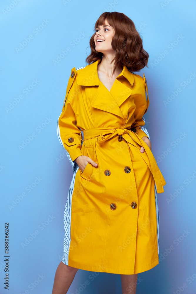 Beautiful Woman Smile look aside hands in pockets red lips Beautiful Woman Smile look aside hands in pockets red lips