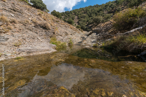 Fototapeta Naklejka Na Ścianę i Meble -  Water flowing down a ravine in the Sierra Nevada