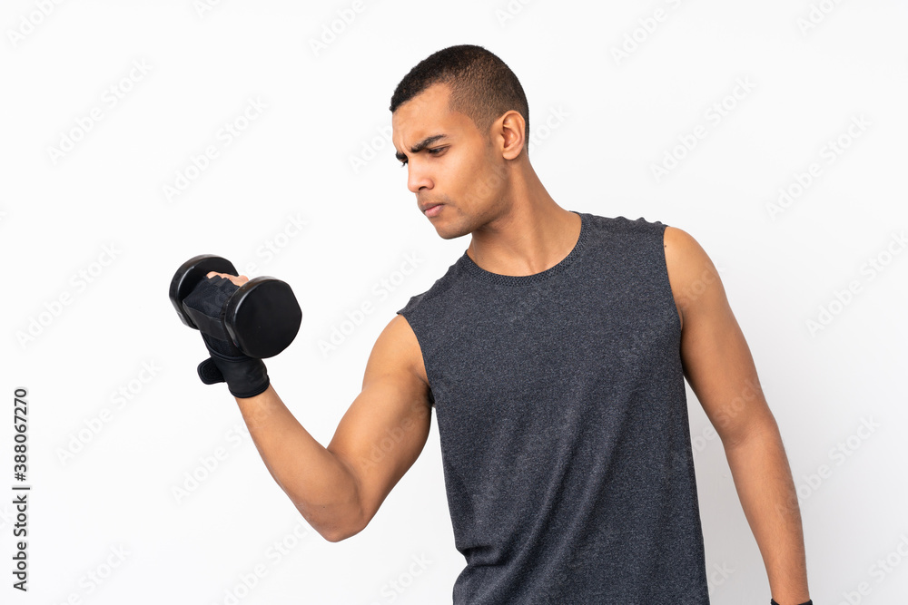 Young African American sport man over isolated white background making weightlifting Young African American sport man over isolated white background making weightlifting