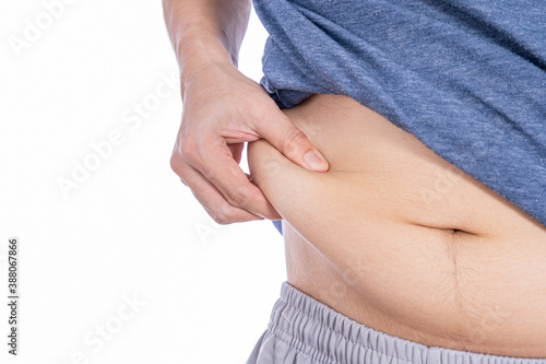 Fat man holding excessive fat belly, overweight fatty belly isolated white background. Diet lifestyle, weight loss, stomach muscle, healthy concept.