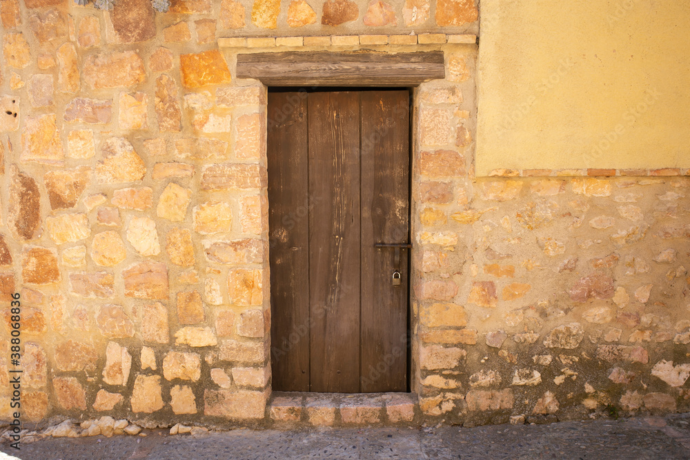 Old wood door from a medieval town in Spain. Old wood door from a medieval town in Spain.