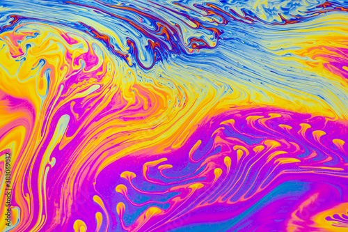 Psychedelic multicolored patterns background. Photo macro shot of soap bubbles